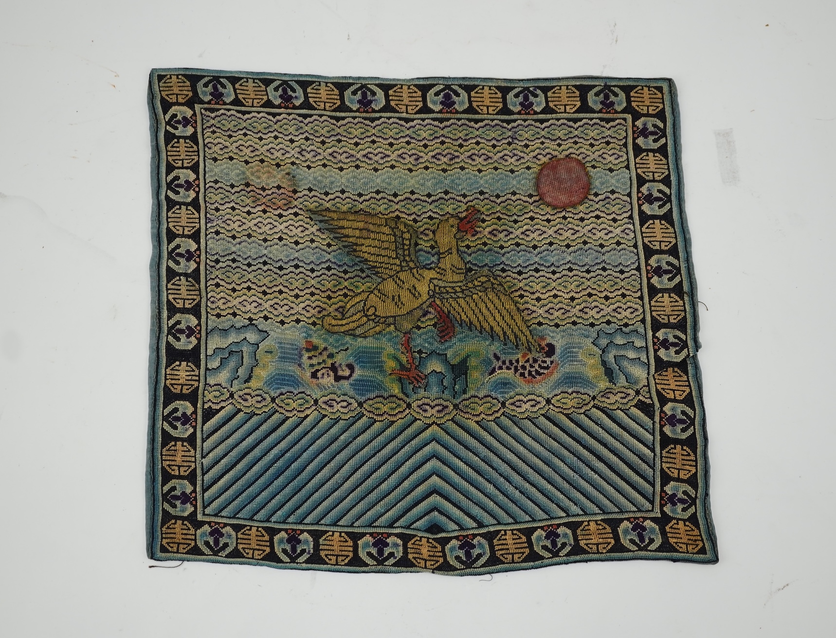 A Chinese needlepoint rank badge, 19th century